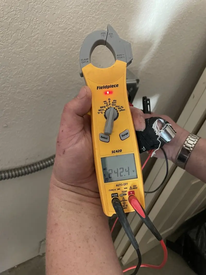 Voltage testing with clamp meter during Whole House Surge Protector in Mariemont